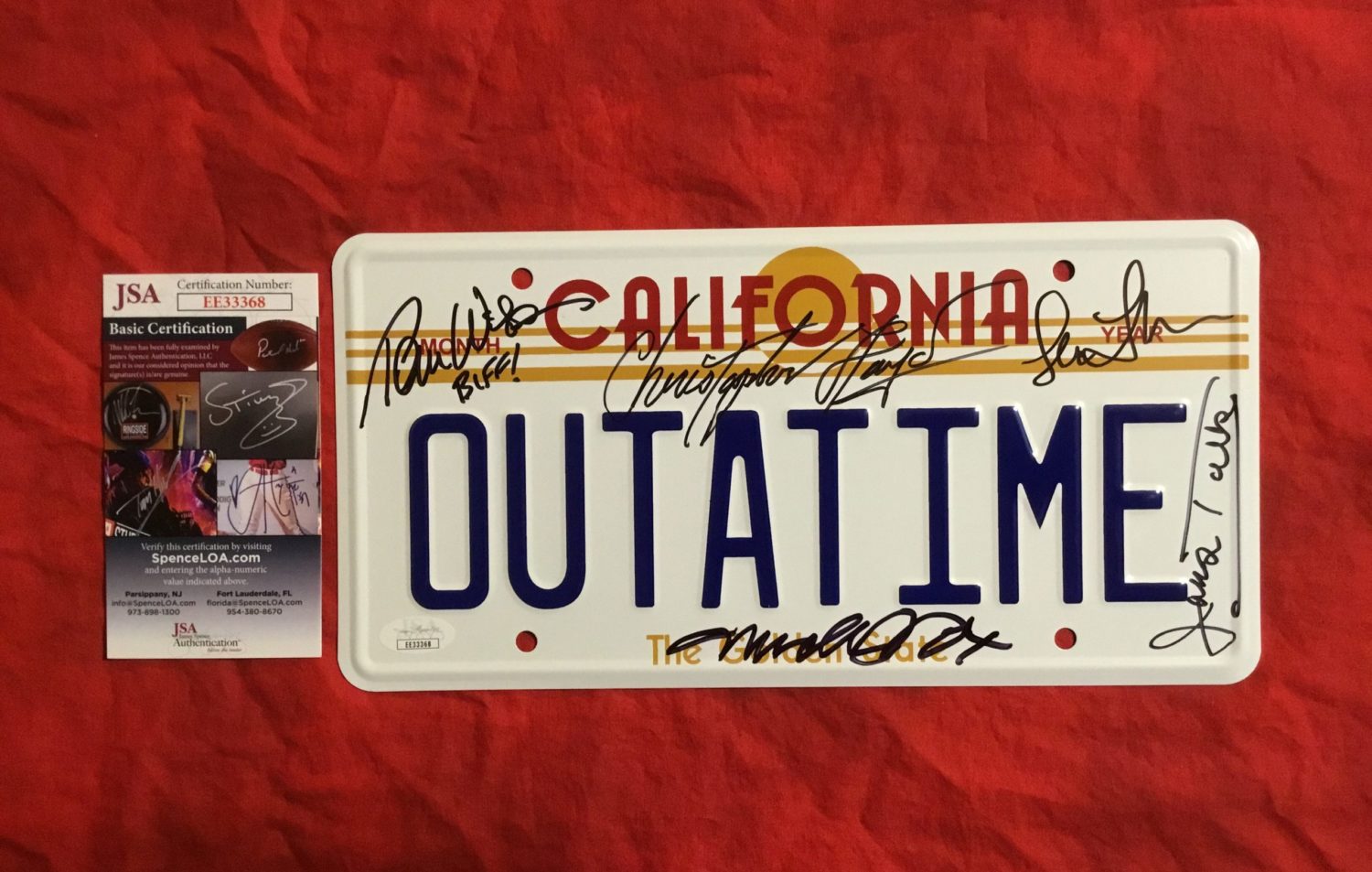 BACK TO THE FUTURE~OUTATIME~CAST SIGNED LICENSE PLATE~ MICHAEL J. FOX+ CHRISTOPHER LLOYD+ LEA THOMPSON+ THOMAS WILSON+ JAMES TOLKAN~JSA COA